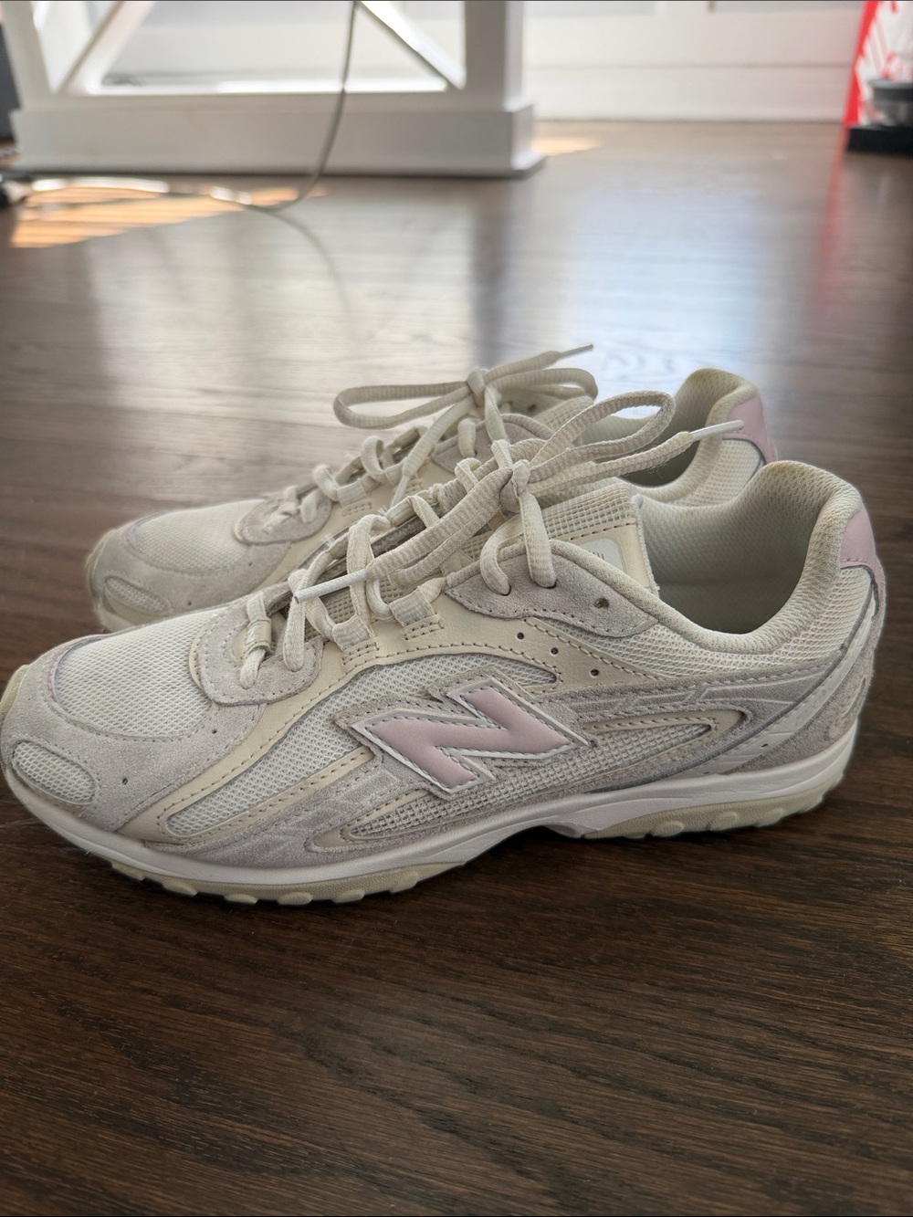 New Balance Women’s White Sneakers with Light Pink Accents